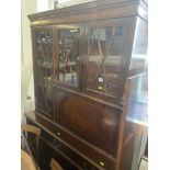 A Mahogany bookcase on cupboard base