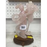 Pink Jadite figure on stand a.