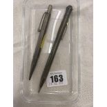 Two silver pens