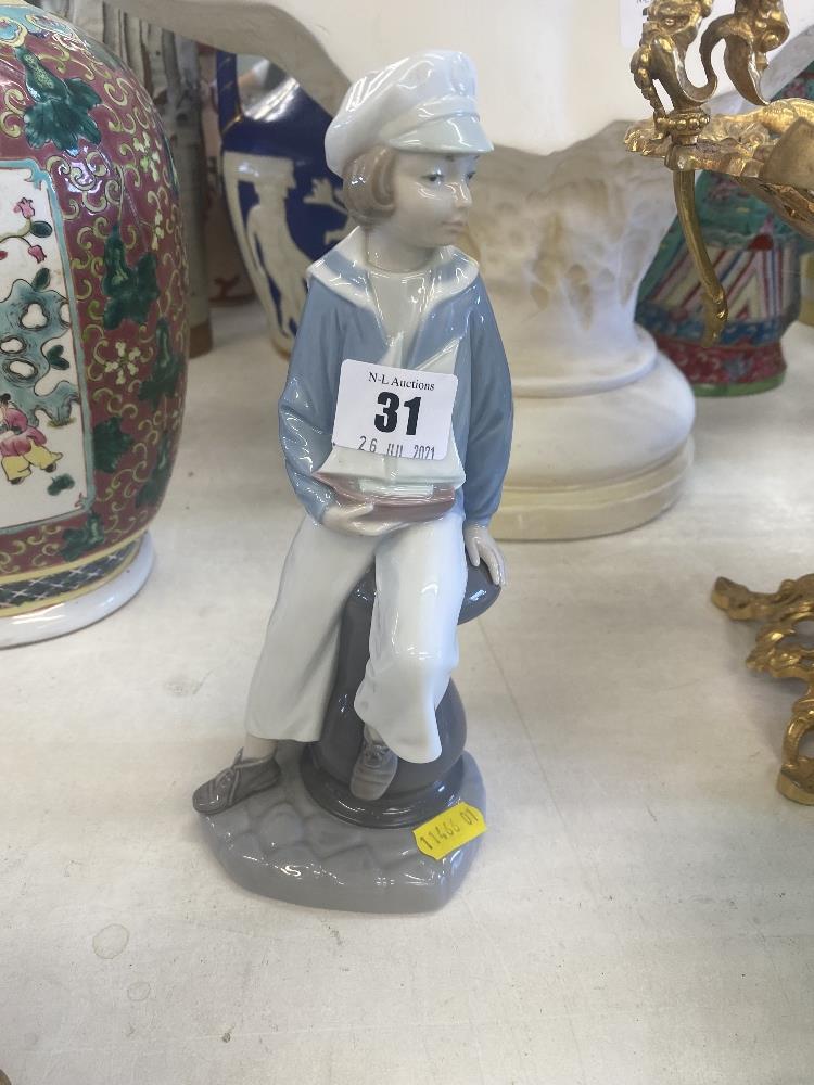 A Lladro figure, sailor boy holding a boat, - Image 2 of 2