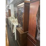 A mahogany bookcase on a cupboard base