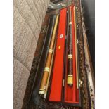 Two cased Snooker cues