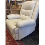 A cream reclining armchair,