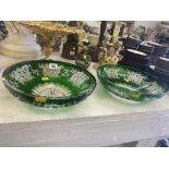 A pair of large green cut glass bowls