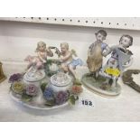 A Meissen group, Cherubs etc.