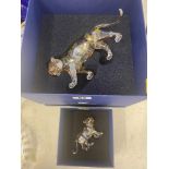 A Swarovski boxed Tiger,