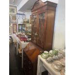 A reproduction bureau bookcase