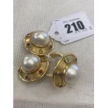 An 18ct hallmarked gold clip earrings and ring set, with Pearls and multi coloured gems,