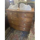 A 19th century mahogany bow front two over three chest of drawers