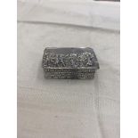 A hallmarked silver carved snuff box