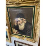 A gilt framed painting of a Rabbi