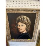 A gilt framed portrait of a lady