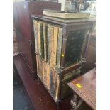 A mahogany bookcase and encyclopedias