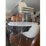 A contemporary circular table and four chairs,