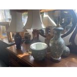 Five decorative lamps and two vases with shades