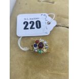 An 18ct Gold multi gem set ring, size L 1/2, set with Rubies, Diamonds, Crystoble cats eye etc.