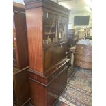 A Mahogany bookcase on cupboard base