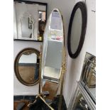 A brass cheval mirror