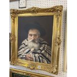 A gilt framed painting of a Rabbi