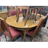 A Yewood dining room suite; extending table,