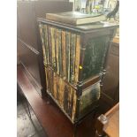 A mahogany bookcase and encyclopedias