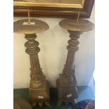 A pair of wood pricket candlesticks