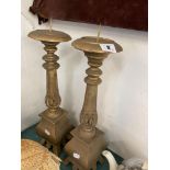 A pair of wood pricket candlesticks