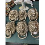 Six silvered Lions head door knockers