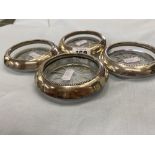 Four coasters with Silver rims