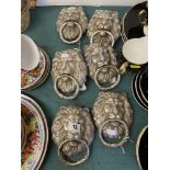 Six silvered Lions head door knockers