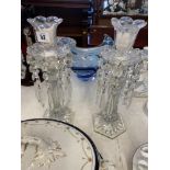 A pair of clear glass candlesticks