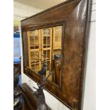 A large Oyster veneered mirror