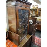 A mahogany bookcase on a cupboard base