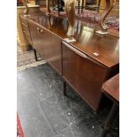 A mid century Walnut dining suite; table,