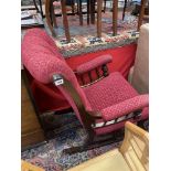 An upholstered button back rocking chair