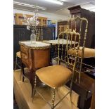 A Benaris table and four brass chairs