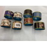 Two boxed sets of four enamelled Cloisonne napkin rings