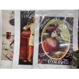 Three Coca Cola advertising posters