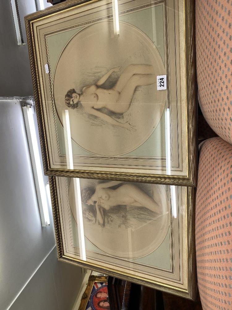 A pair of gilt framed prints of nudes