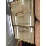 A pair of gilt framed prints of nudes