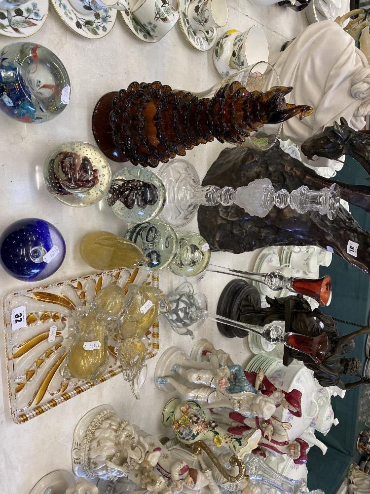 A collection of glass paperweights and other items