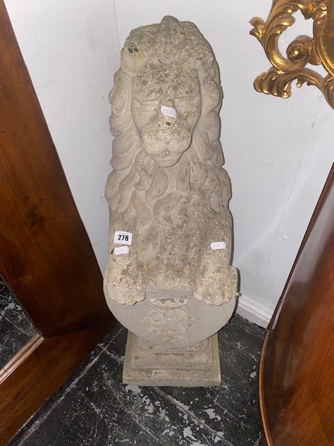 A stone garden figure of a Lion