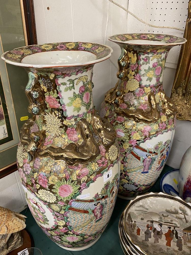 A pair of Canton style vases,