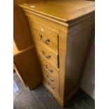 A tall Oak five drawer chest