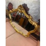 A decorative gilt mirror