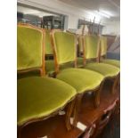 A set of twelve upholstered dining chairs