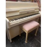 A White Artdeco style Piano and stool