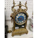 A gilt metal clock a.