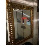 A rectangular gilt mirror