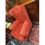 An Edwardian upholstered armchair